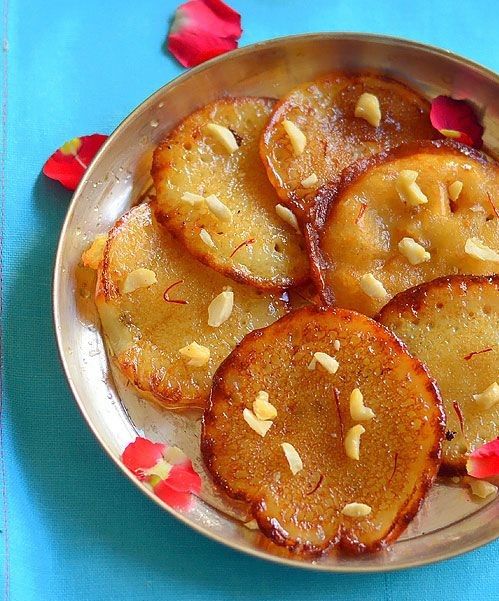 
Chenna Malpua, a famous sweet in Jaipur, made with chenna, fried, and soaked in sugar syrup for a rich taste