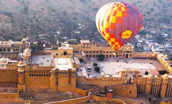 
"Hot air balloon ride over Jaipur's scenic landscapes, offering breathtaking views of forts and palaces."