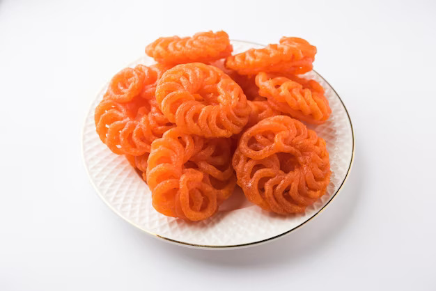 
Imarti, a bright and sugary traditional sweet in Jaipur, made from urad dal and shaped into intricate coils.